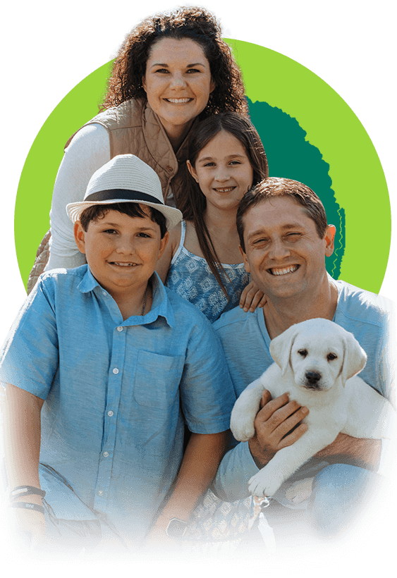 image of a family holding their new lab puppy